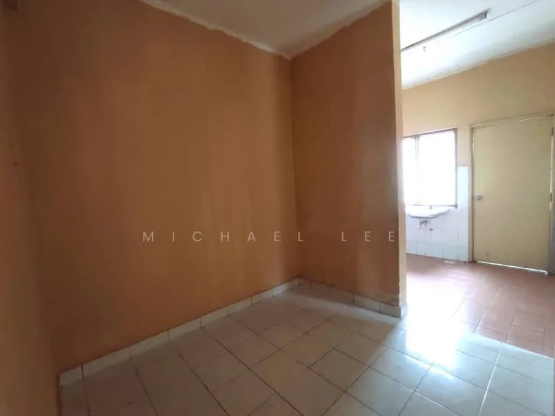 Room features: orange painted walls, white tiled flooring, window with natural light, door leading to another room, corner of the room visible.