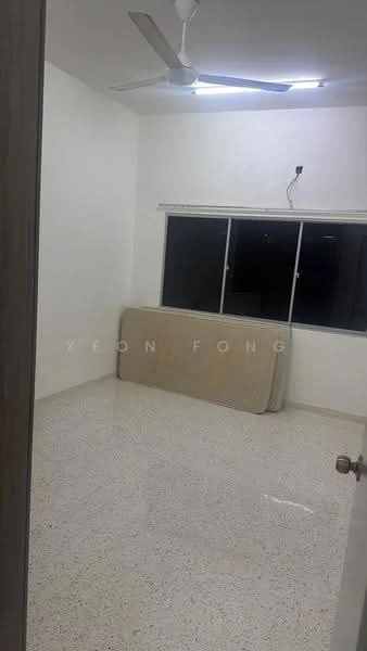 Room features: white painted walls, polished concrete flooring, ceiling fan, large window, window with blinds, mattress leaning against wall.