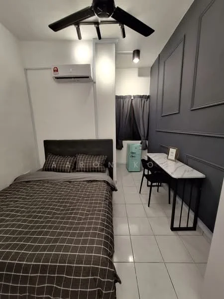 Bedroom features: queen-size bed with grey checkered bedding, black upholstered headboard, white walls, grey accent wall with paneling, white tiled flooring, 1 wall-mounted split AC, 5-blade ceiling fan, black desk with chair, green fridge, curtains in dark grey; style: modern.