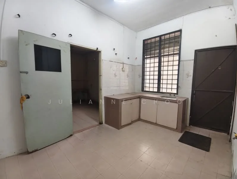 Kitchen features: white tiled walls, light-colored cabinetry, countertop with sink, single-bowl stainless-steel sink, window with metal grille, floor tiles in light color, door leading to another room, door leading outside.