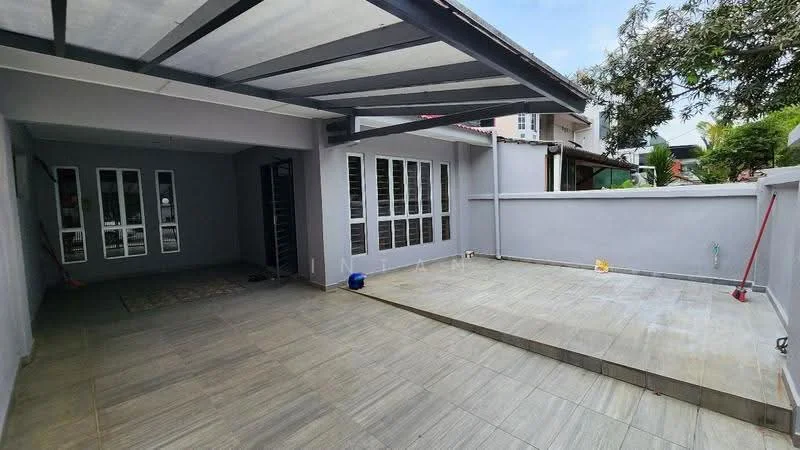 Exterior type: linked terrace house; features: grey painted facade, flat roof with overhang, paved outdoor area, manicured lawn, fenced perimeter, car porch with awning, large windows, sliding glass door, outdoor lighting, concrete wall, tiled flooring; style: modern.