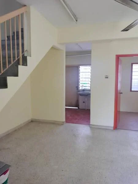 Room features: light-colored painted walls, concrete flooring, staircase with metal railing, window with horizontal slats, door leading to another room, ceiling with fluorescent lights; style: minimalist.