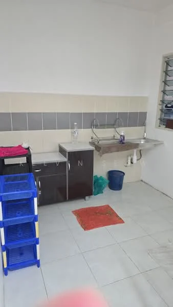 Kitchen features: white painted walls, grey tiled backsplash, ceramic tile flooring, single-bowl stainless-steel sink, chrome faucet, dark wood cabinetry, countertop with storage space, plastic storage racks in blue, red area rug.