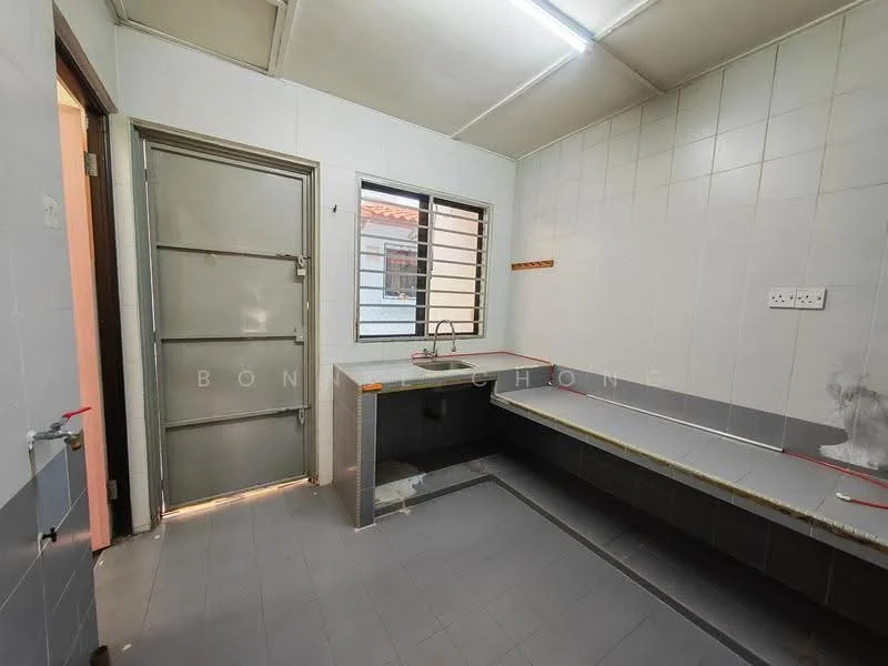 Kitchen features: grey tiled flooring, white tiled walls, single-bowl stainless-steel sink, chrome pull-down faucet, countertop with grey surface, window with metal grille, door leading outside, built-in countertop space, light fixture on ceiling.