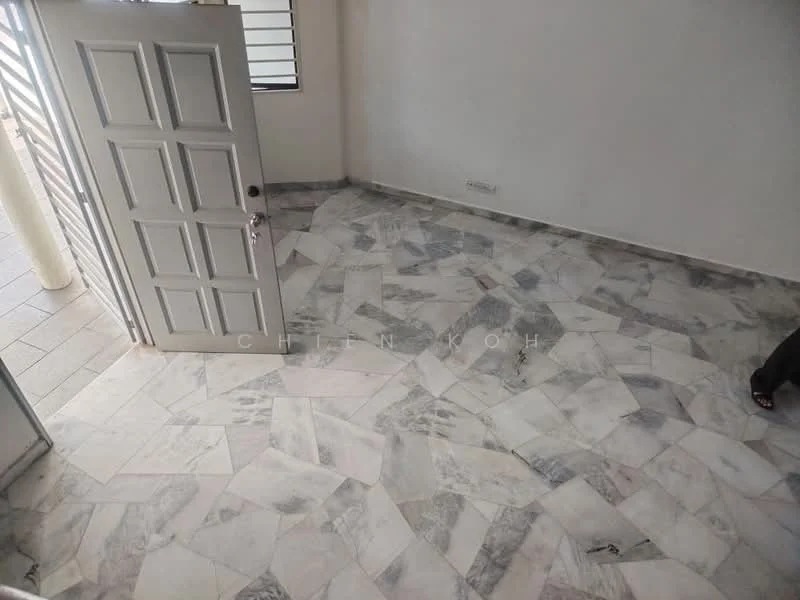 Room features: grey marble flooring, white walls, single door with grey finish, large windows with horizontal bars, natural light from windows.