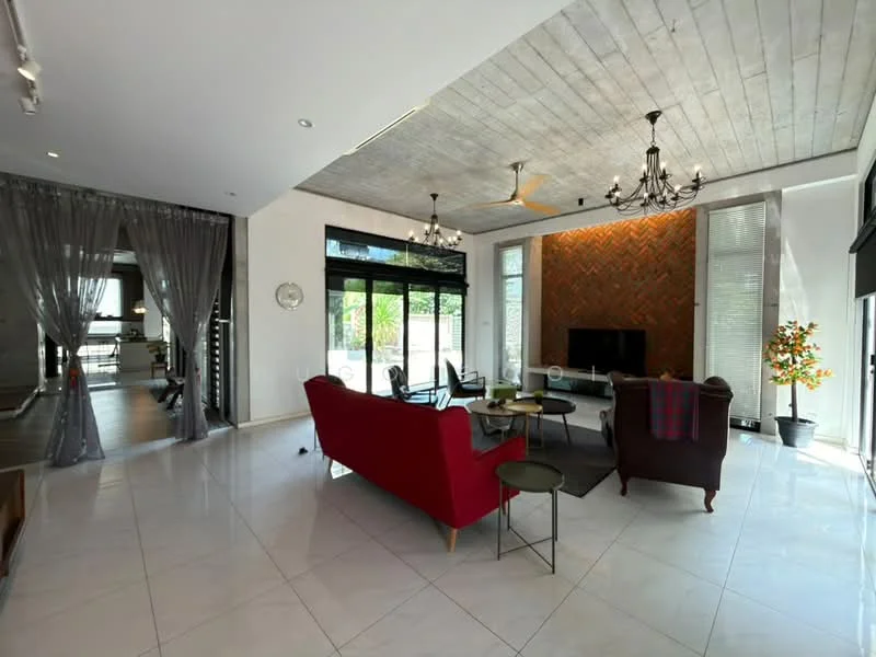 Living features: red fabric sofa, 3-seater sofa, coffee table, wall-mounted TV, chandelier, exposed concrete ceiling, large windows, grey accent wall with herringbone pattern, marble tile flooring, ceiling fan, decorative plant in ceramic pot, sheer curtains; style: modern; view: garden. Room features: grey curtains, wooden flooring, open layout.