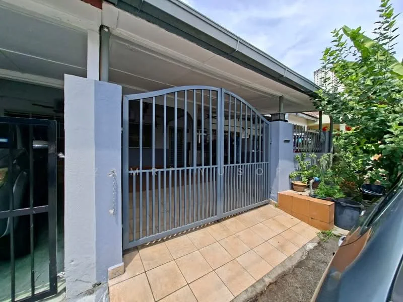 Exterior type: linked terrace house; features: metal gate, grey painted facade, tiled walkway, planter box with plants, covered porch, exposed concrete wall, surrounding greenery; style: modern.