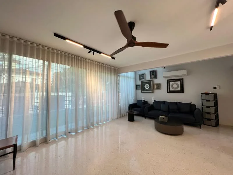 Living features: 5-blade ceiling fan with light, recessed LED downlights, floor-to-ceiling windows, sheer curtains, polished concrete flooring, L-shape sectional sofa in dark fabric, round coffee table, decorative wall art, air conditioning unit, built-in storage cabinet; style: modern; view: garden.