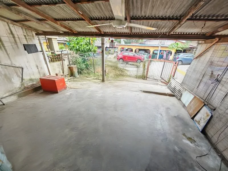 Exterior features: concrete flooring, metal roof, ceiling fan, open space, fenced area, surrounded by greenery, driveway access.
