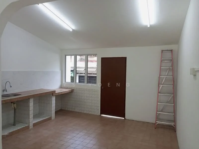 Kitchen features: single-bowl stainless-steel sink, marble countertop, white tiled backsplash, brown wooden cabinetry, tile flooring, fluorescent ceiling lights, window with view to outside, door leading to outside, ladder against wall.