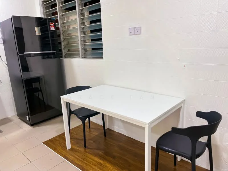 Kitchen features: black fridge, white dining table, 2 black chairs, tile flooring, white walls, window with horizontal slats, wooden mat under table; style: modern.