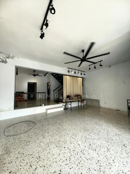 Living features: exposed concrete walls, white painted walls, polished terrazzo flooring, 5-blade ceiling fan, track lighting, open layout, staircase in background, large mirror, minimalist decor, seating area, decorative shelving, natural light from windows; style: modern.