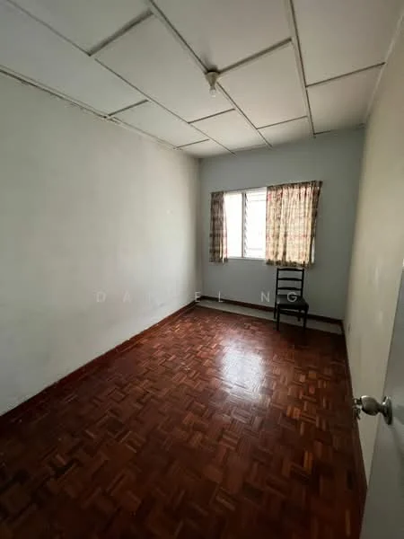 Room features: white painted walls, parquet wood flooring, ceiling light fixture, single window with curtains, wooden chair.
