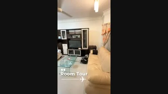 Living features: 3-seater leather sofa in cream, glass coffee table, TV console, wall-mounted TV, built-in shelving unit, ceiling fan, white painted walls, light-colored flooring, decorative curtains; style: modern.