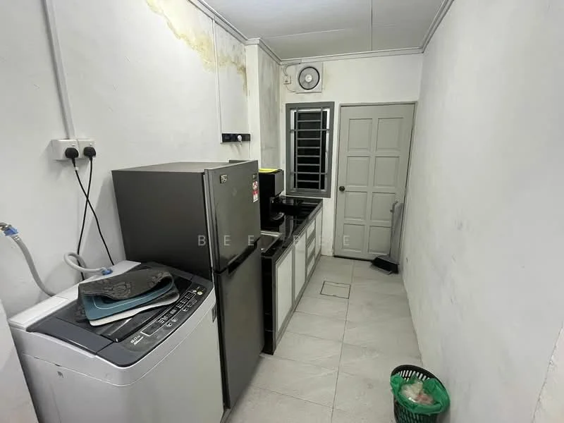 Laundry features: white painted walls, tile flooring, front-load washing machine, stainless-steel fridge, black countertop, sink with faucet, window with grille, door to hallway, waste bin.