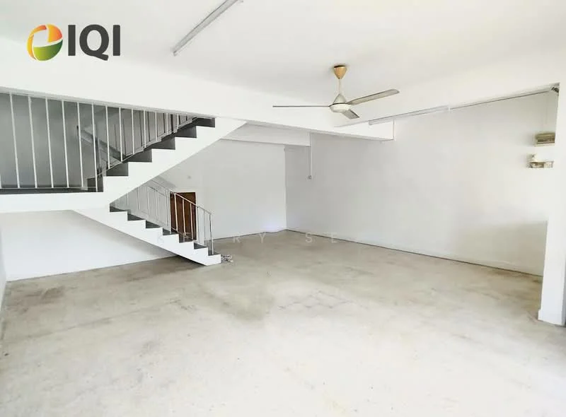 Room features: white painted walls, concrete flooring, ceiling fan, staircase with metal railing, large open space, natural light from windows, no visible furniture, high ceiling; style: minimalist.
