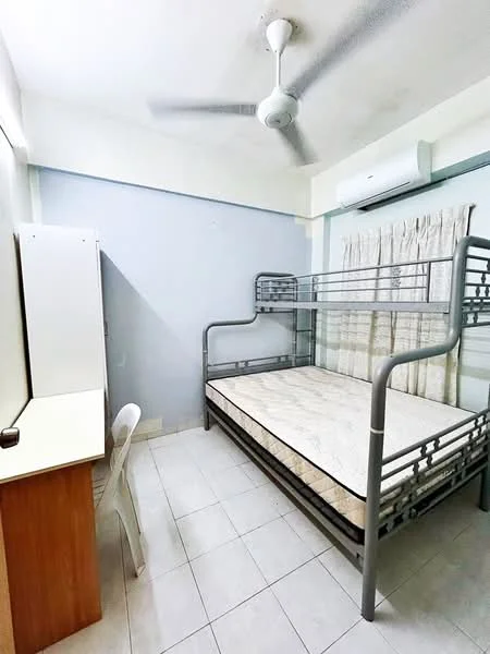 Bedroom features: bunk bed with metal frame, mattress on top bunk, white walls, ceiling fan, wall-mounted air conditioning unit, window with sheer curtains, desk with wooden surface, plastic chair, tiled flooring; style: minimalist.