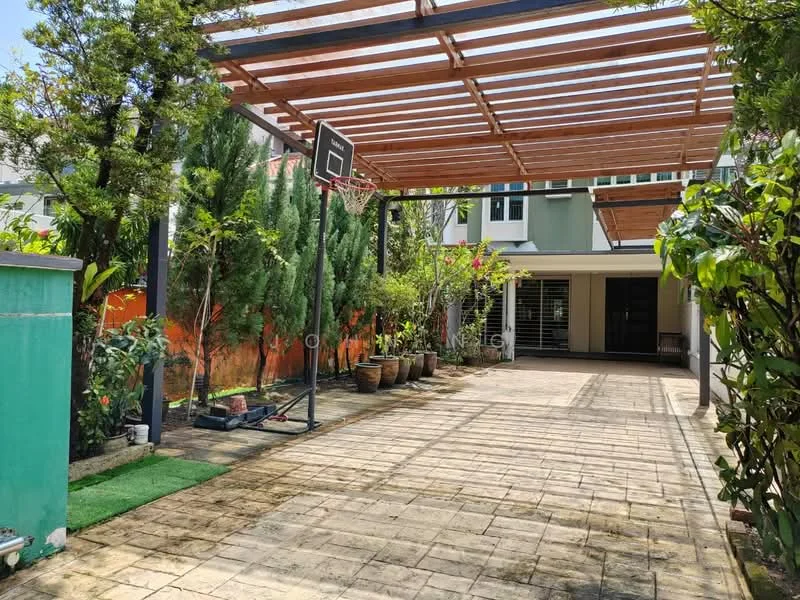 Exterior type: detached bungalow; features: paved driveway, basketball hoop, manicured landscaping, mature trees, flowering plants in pots, wooden pergola, green grass patch, fenced perimeter, exterior wall with orange paint, covered parking area; style: modern.