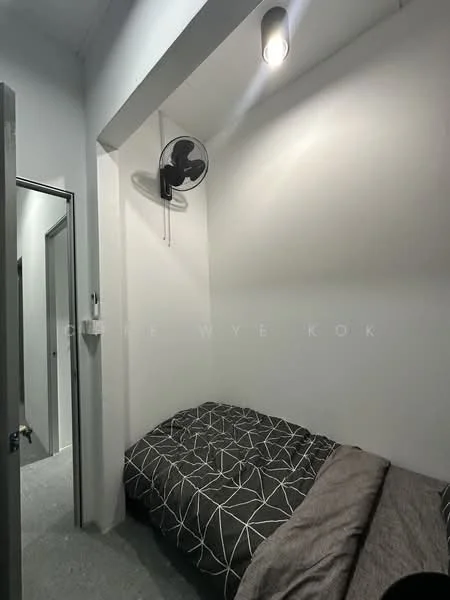 Bedroom features: white painted walls, grey flooring, single bed with patterned bedding, ceiling fan, recessed lighting, door leading to hallway, minimalist decor; style: modern.