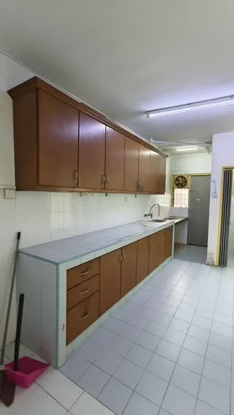 Kitchen features: brown wooden cabinetry, white tiled backsplash, grey countertop, single-bowl stainless-steel sink, chrome faucet, built-in oven, white tiled flooring, fluorescent ceiling lights.