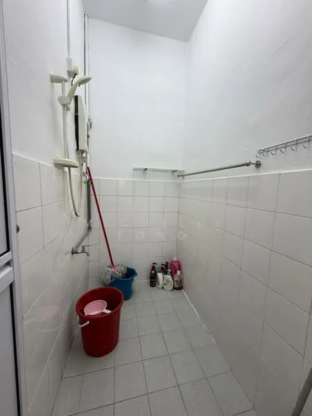 Laundry features: white tiled walls, grey tiled flooring, shower head, wall-mounted clothes rack, bucket, cleaning supplies, broom, mop.