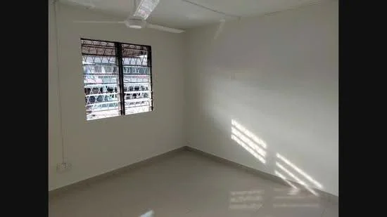 Room features: white painted walls, tile flooring, window with metal grille, natural light from window, ceiling fan, corner room.