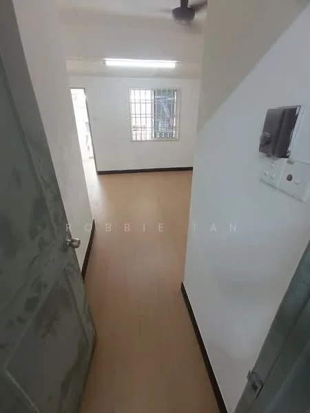 Room features: laminate flooring, white painted walls, ceiling light fixture, window with metal grille, door with handle, light switch, power outlet.