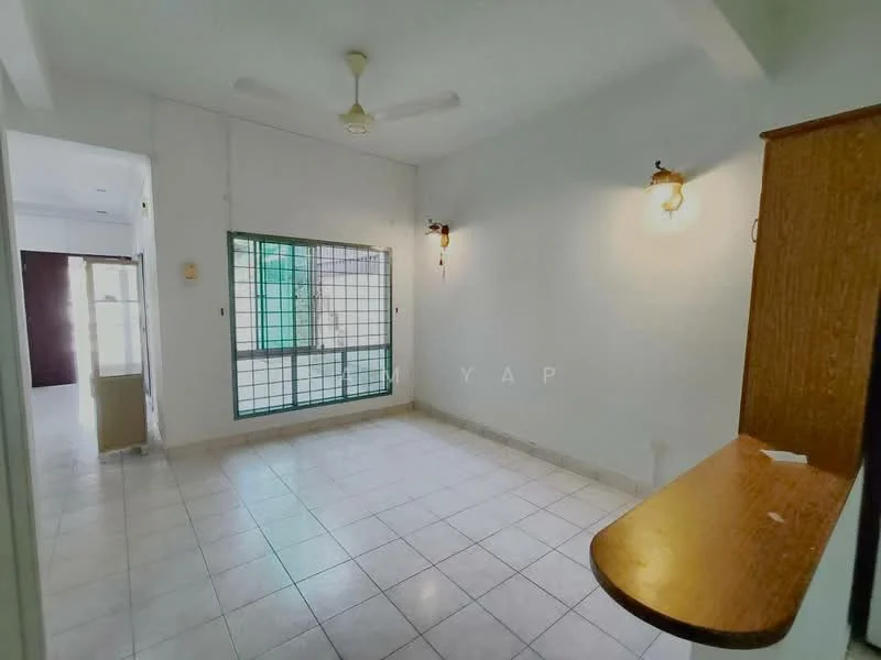 Room features: white painted walls, tile flooring, ceiling fan, window with security grille, wall-mounted light fixtures, built-in wooden shelf, open layout, natural light from window.