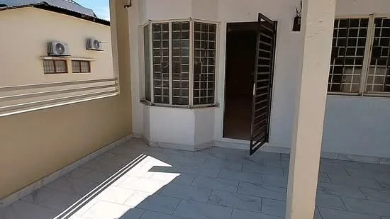 Room features: marble tile flooring, white painted walls, large windows with grid pattern, single door with metal grille, exterior wall-mounted air conditioning units, corner window, open layout, natural light; style: modern.