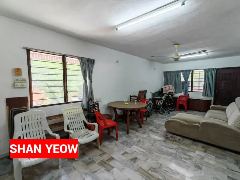 Living features: white painted walls, grey tiled flooring, ceiling fan, 2-seater fabric sofa in beige, round dining table, 4 dining chairs, 2 plastic chairs in white, 2 plastic chairs in red, window with sheer curtains, bicycle in corner, wooden cabinet, light fixture on ceiling.