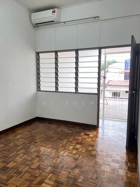 Room features: wooden flooring, white painted walls, sliding windows, air conditioning unit, door leading to balcony, natural light from windows.