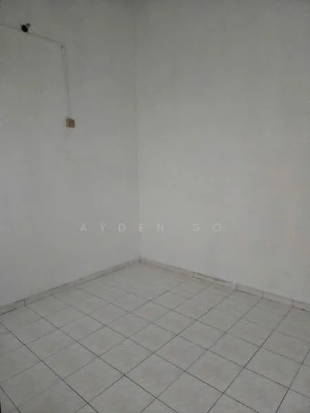 Room features: white painted walls, ceramic tile flooring, single light fixture, corner electrical outlet.