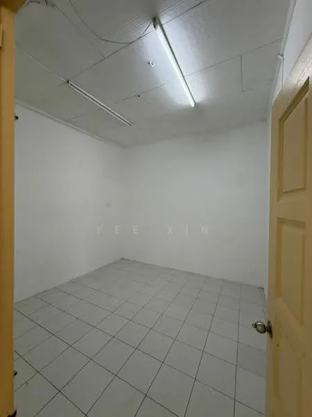 Room features: white painted walls, plain ceiling, fluorescent lighting, white tiled flooring, single door, no visible furniture or decor; style: minimalist.