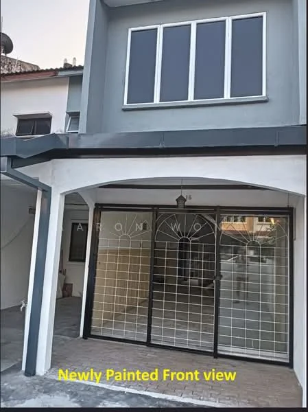 Exterior type: linked terrace house; features: newly painted facade in grey, black metal grille door, three large windows with black frames, paved driveway, covered porch area, two-storey structure, gabled roof, outdoor light fixture; style: modern.
