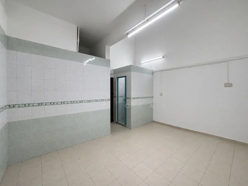 Room features: white tiled walls, light green tiled walls, grey tiled flooring, fluorescent ceiling lights, partition wall, doorway, empty space; style: minimalist.
