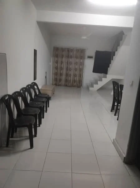 Room features: white painted walls, glossy ceramic tile flooring, ceiling with recessed lighting, staircase with white risers, curtains with patterned design, black plastic chairs, wooden bench, dining table with chairs; style: modern.