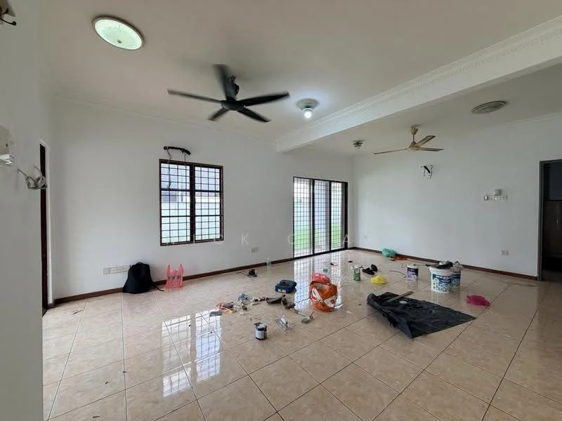 Living features: white painted walls, cream tiled flooring, 5-blade ceiling fan, 2 ceiling lights, floor-to-ceiling windows, sliding glass door, window treatments, decorative ceiling moulding, various paint cans and tools scattered on the floor.