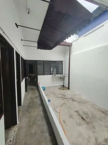 Room features: concrete flooring, white painted walls, overhead awning, window with metal grilles, sink with faucet, exposed electrical wiring, light fixture, open layout; style: minimalist.