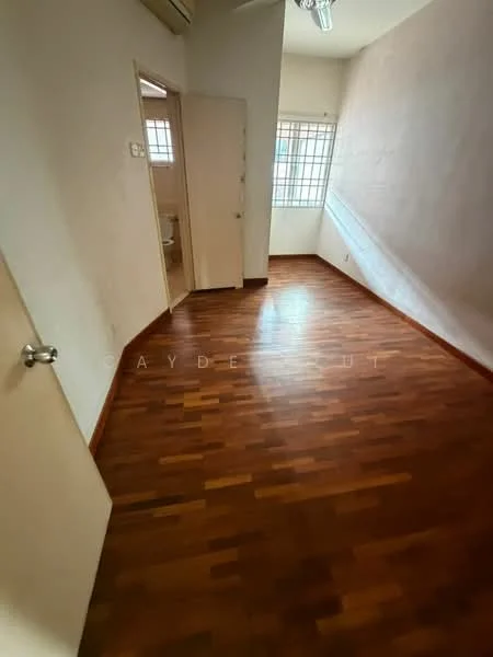 Room features: wooden flooring, white painted walls, ceiling fan, window with grid, door leading to another room, natural light from window.