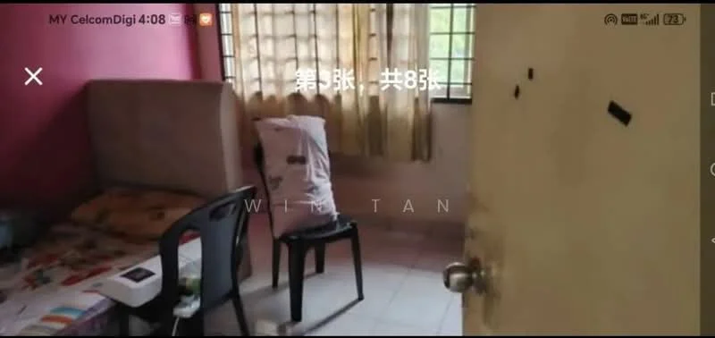 Room features: single bed with bedding, plastic chair, window with sheer curtains, light yellow painted walls, tiled flooring, wooden door, bedside table, wall-mounted hooks.