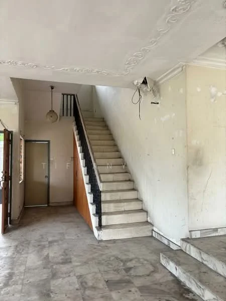 Room features: staircase with black railing, white painted walls, ceiling with decorative moulding, marble flooring, door leading to exterior, window with no visible treatment, light fixture on ceiling, exposed electrical wiring.