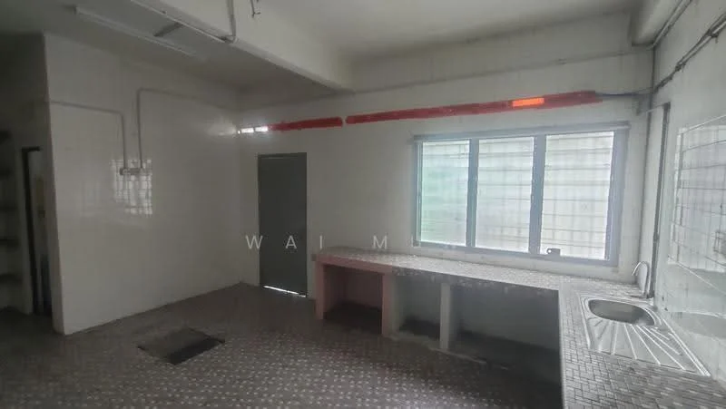 Kitchen features: white tiled walls, grey tiled flooring, single-bowl stainless-steel sink, chrome pull-down faucet, countertop with pink base, window with grid pattern, door leading outside, open shelving, exposed plumbing, ceiling lights.