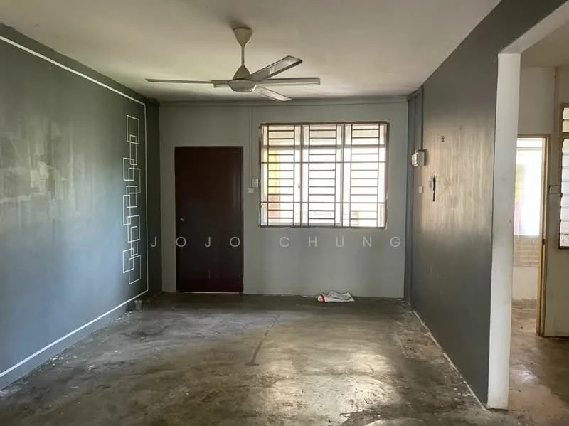 Room features: grey painted walls, concrete flooring, 5-blade ceiling fan, window with horizontal bars, wooden door, light switch, power outlet; style: minimalist.