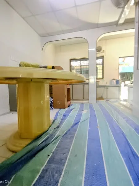 Kitchen features: round dining table, yellow table surface, blue and green striped rug, white tiled flooring, white walls, kitchen cabinetry, window with natural light, ceiling fan.