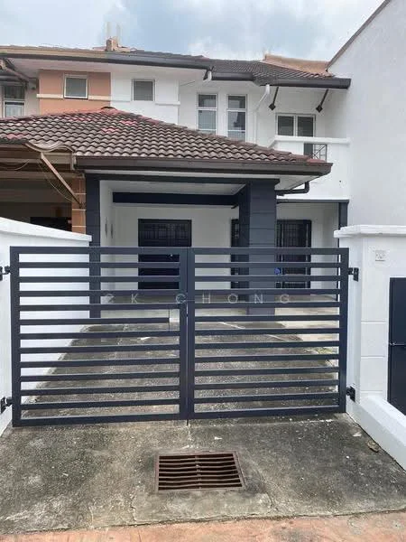 Exterior type: linked terrace house; features: grey metal gate, paved driveway, white painted facade, dark grey accent wall, red tiled roof, front porch area, two-storey structure, windows with dark frames; style: modern.