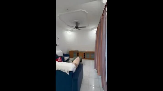 Living features: white painted walls, glossy white tile flooring, 5-blade ceiling fan with light, sofa in blue fabric, throw pillows in red, wooden console cabinet, curtains in light brown, recessed lighting, decorative wall shelf; style: modern.