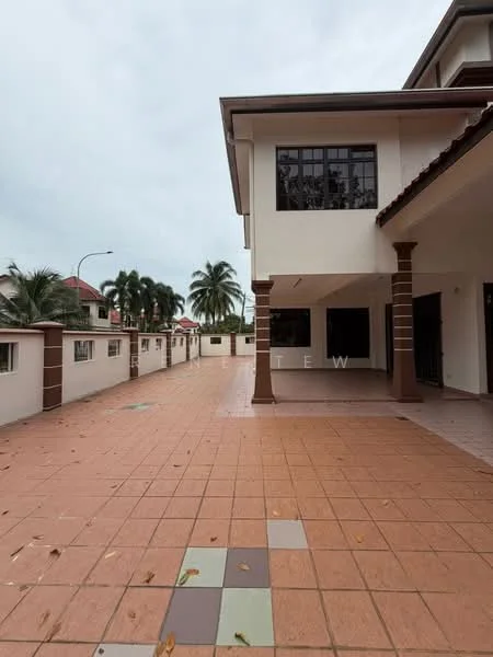 Exterior type: detached bungalow; features: tiled flooring, covered porch, white painted facade, brown columns, manicured landscaping, paved driveway, surrounded by palm trees, fenced perimeter, open space, multiple windows, gated entry; style: modern.