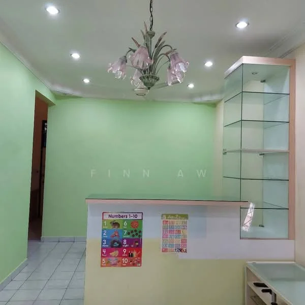 Room features: green painted walls, white ceiling with recessed downlights, tile flooring, glass display cabinet, countertop, chandelier with floral design, educational wall posters, open layout; style: modern.