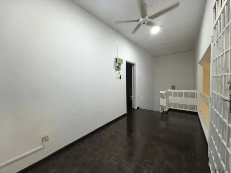 Room features: white painted walls, dark wood parquet flooring, ceiling fan, doorway leading to another room, window with grille, light fixture on ceiling, baseboard, wall-mounted intercom; style: minimalist.