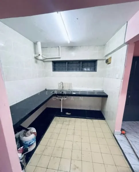 Kitchen features: black granite countertop, white tiled backsplash, single-bowl stainless-steel sink, chrome faucet, white painted walls, pink accent wall, tile flooring, window with security bars, wall-mounted pipe, open shelving, built-in cabinetry.